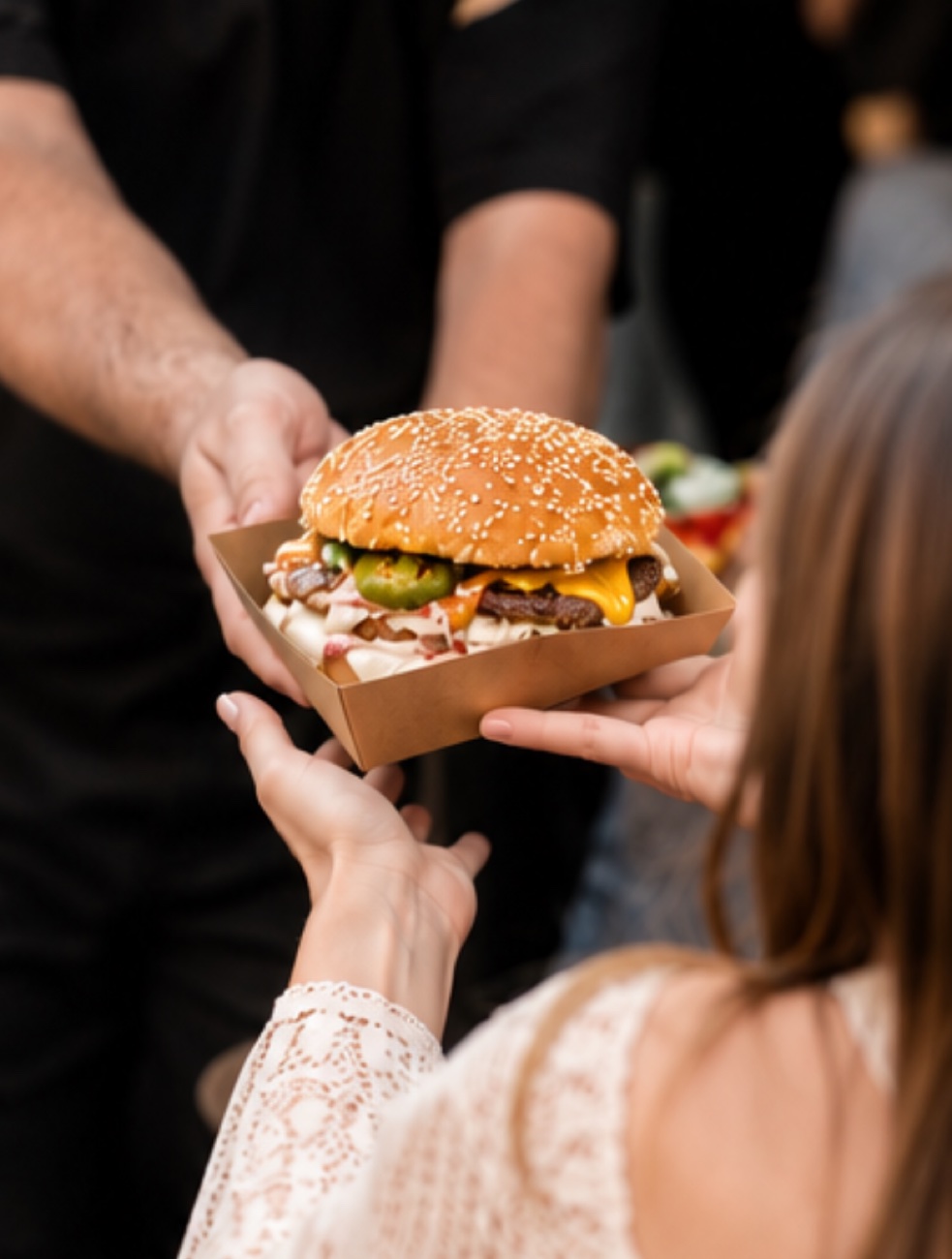 A freshly cooked Chuck and Blade burger being served